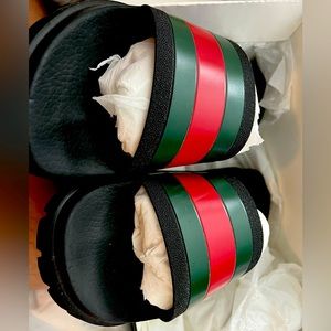 Men Gucci Slides with minimal wear.  Only worn twice
